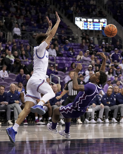 Kansas, ranked 12th, rallies from a 14-point deficit to defeat TCU 74-61