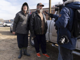 Supporters of President Donald Trump, Kevin Loftus, left and William Sarsfield III, who were convicted for participating in the Jan. 6 riot at the U.S. Capitol, talk to reporters after being pardoned and released in the early morning hours from the Philadelphia Federal Detention Center before traveling to Washington, Tuesday, Jan. 21, 2025. (AP Photo/Jose Luis Magana)