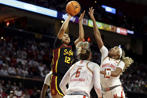 JuJu Watkins contributes 21 points as No. 4 USC defeats No. 8 Maryland 79-74, dealing the Terps their first defeat.