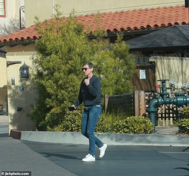 Dressed casually in a gray crew neck sweater, blue jeans, and sneakers, DeGeneres was seen pulling into a visitor's parking spot before entering a resident building at Casa Dorinda

