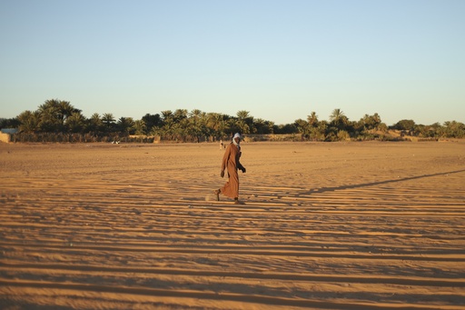 An advancing desert poses a risk to houses and heritage.