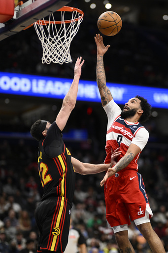 Trae Young records 35 points and 14 assists in Atlanta’s 125-111 win against Washington.