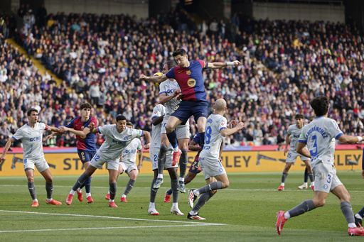 Lewandowski’s goal secures victory for Barcelona over Alaves, inching them closer to Spanish league leaders.