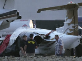 Aircraft Crash Arizona Investigators look at a crashed Learjet at Scottsdale Airport after it collided with a parked plane Monday, Feb. 10, 2025, in Scottsdale, Ariz. (AP Photo/Ross D. Franklin)