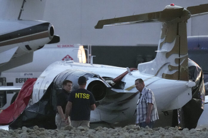 Aircraft Crash Arizona Investigators look at a crashed Learjet at Scottsdale Airport after it collided with a parked plane Monday, Feb. 10, 2025, in Scottsdale, Ariz. (AP Photo/Ross D. Franklin)