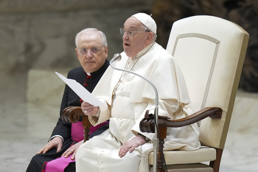 Pope Francis trips during his arrival at Jubilee audience in the Vatican after his cane breaks