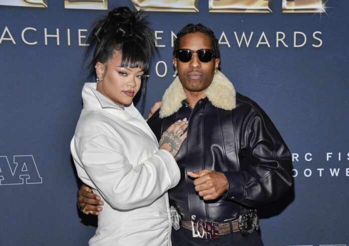 A$AP-Rocky-Shooting-Trial FILE - Collaboration of the year honoree A$AP Rocky, right, and Rihanna attend the 38th annual Footwear News Achievement Awards at Cipriani South Street on Dec. 4, 2024, in New York. (Photo by Evan Agostini/Invision/AP, file)