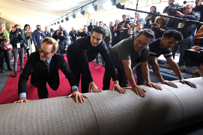 HOLLYWOOD, CALIFORNIA - FEBRUARY 26: Conan O'Brien (L) attends the 97th Annual Academy Awards carpet roll out at Dolby Theatre on February 26, 2025 in Hollywood, California. (Photo by Kevin Winter/Getty Images)