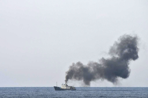 Officials report a fire on a Russian spy vessel near the coast of Syria; audio of its communications is available.