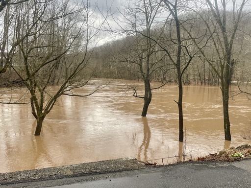 Flooding along the swollen Pocatalico River is shown Thursday, Feb. 6, 2025, in Poca, W.Va. (AP Photo/John Raby)