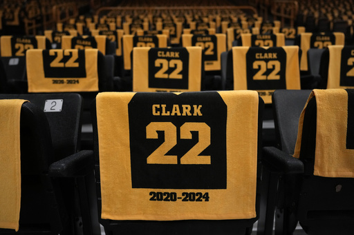 Iowa pays tribute to Caitlin Clark by retiring her jersey and displaying it in the arena rafters.