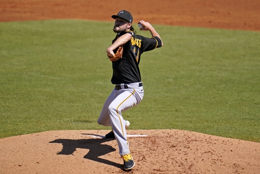 Yankees pitcher JT Brubaker adjusts his side in an effort to dodge a comebacker that struck him in the back