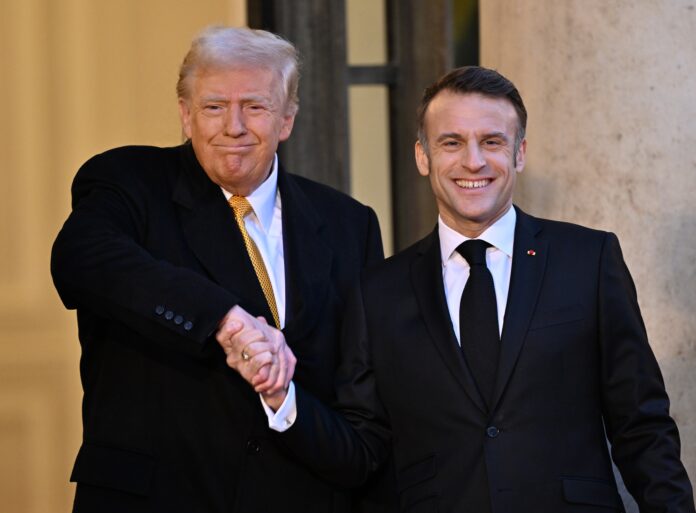 PARIS, FRANCE - DECEMBER 07: French President Emmanuel Macron (R) and US President-elect Donald Trump (L) pose before their meeting at the Elysee Palace in Paris, France on December 07, 2024. (Photo by Mustafa Yalcin/Anadolu via Getty Images)