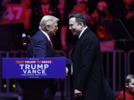 WASHINGTON, JANUARY 19: Tesla Founder Elon Musk walks on stage with his son, X, beside President-elect Donald Trump during a rally at Capital One Arena in Washington, on January 19, 2025. Trump held a rally downtown ahead of tomorrow's 60th Presidential Inauguration. (Photo by Tom Brenner for The Washington Post via Getty Images)