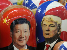 FILE - Traditional Russian wooden dolls called Matryoshka depicting China's President Xi Jinping, left, and U.S. President Donald Trump are on sale at a souvenir shop in St. Petersburg, Russia, on Nov. 21, 2024. (AP Photo/Dmitri Lovetsky, File)