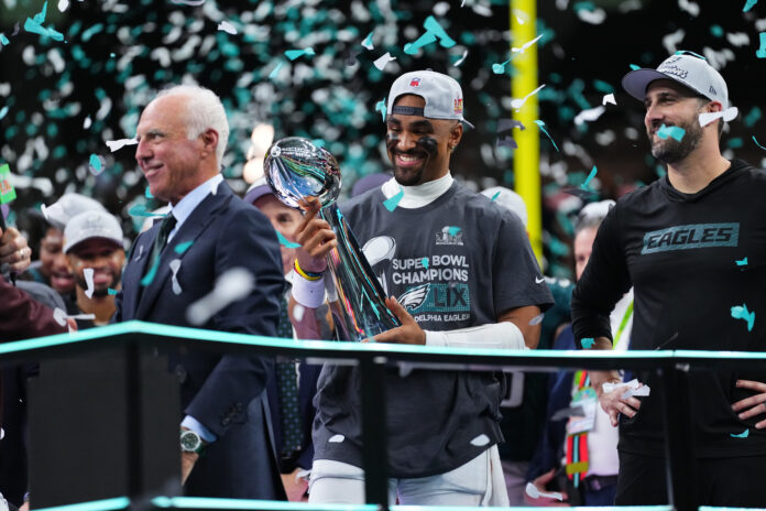 NEW ORLEANS, LA - FEBRUARY 09: Jalen Hurts #1 of the Philadelphia Eagles holds the Vince Lombardi Trophy after defeating the Kansas City Chiefs during Super Bowl LIX at Caesars Superdome on February 9, 2025 in New Orleans, Louisiana. (Photo by Cooper Neill/Getty Images)