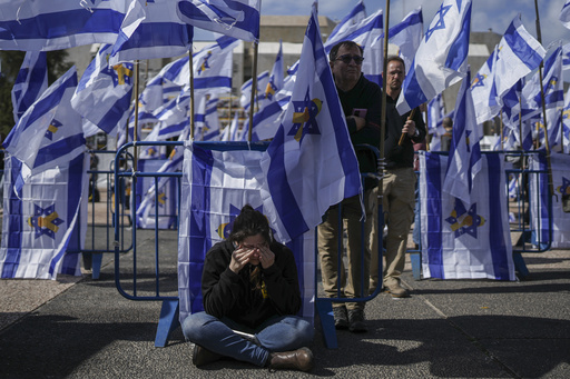 The Bibas family in Israel grieves for their two young sons while hoping for news about their mother.