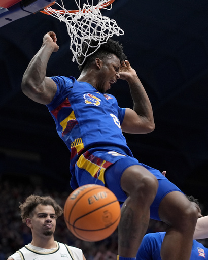 Kansas, ranked 17th, overcomes challenges to defeat Colorado 71-59 with Hunter Dickinson scoring 19 points.