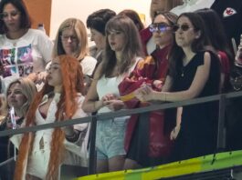 Ice Spice, from left, Taylor Swift, Este Haim and Alana Haim watch during the first half of the NFL Super Bowl 59 football game between the Kansas City Chiefs and the Philadelphia Eagles, Sunday, Feb. 9, 2025, in New Orleans. (AP Photo/Gerald Herbert)