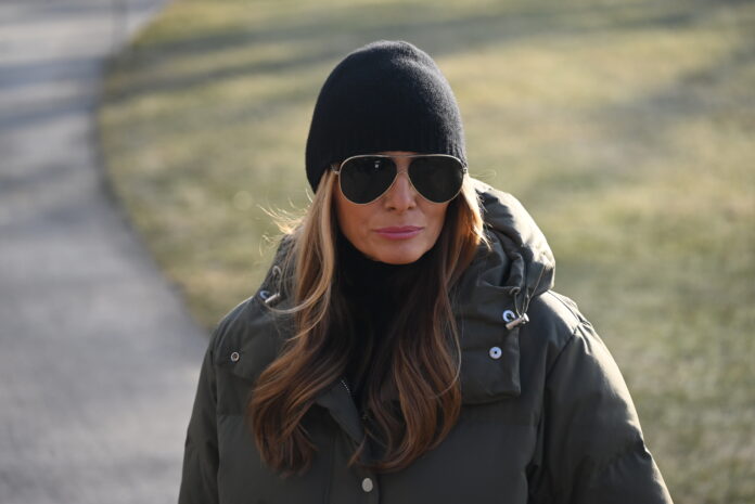 WASHINGTON, D.C., UNITED STATES - JANUARY 24: President of the United States Donald J. Trump (not seen) takes questions from the press with First Lady of the United States Melania Trump by his side on the South Lawn of the White House prior to departing on Marine One for the first trip of his second term to North Carolina and California in Washington, D.C., United States on January 24, 2025. (Photo by Kyle Mazza/Anadolu via Getty Images)