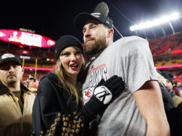 KANSAS CITY, MISSOURI - JANUARY 26: Tight end Travis Kelce #87 of the Kansas City Chiefs celebrates with Taylor Swift after the AFC Championship football game against the Buffalo Bills, at GEHA Field at Arrowhead Stadium on January 26, 2025 in Kansas City, Missouri. (Photo by Brooke Sutton/Getty Images)