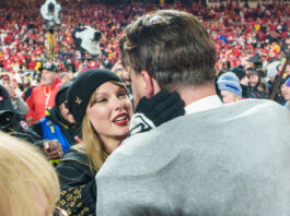 KANSAS CITY, MISSOURI - JANUARY 26: Taylor Swift embraces tight end Travis Kelce #87 of the Kansas City Chiefs following the AFC Championship NFL football game against the Buffalo Bills at GEHA Field at Arrowhead Stadium on January 26, 2025 in Kansas City, Missouri. (Photo by Todd Rosenberg/Getty Images)