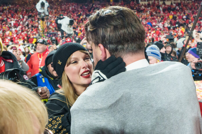 KANSAS CITY, MISSOURI - JANUARY 26: Taylor Swift embraces tight end Travis Kelce #87 of the Kansas City Chiefs following the AFC Championship NFL football game against the Buffalo Bills at GEHA Field at Arrowhead Stadium on January 26, 2025 in Kansas City, Missouri. (Photo by Todd Rosenberg/Getty Images)