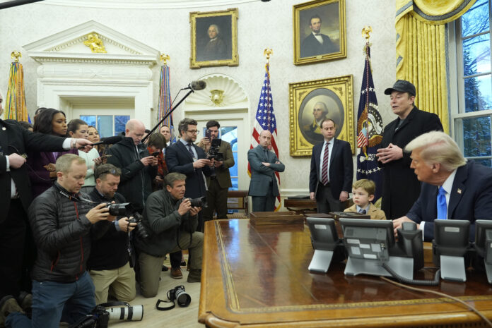 Elon Musk speaks during an event in the Oval Office as President Donald Trump and Musk's son X Æ A-Xii, listen at the White House, Tuesday, Feb. 11, 2025, in Washington. (Photo/Alex Brandon)