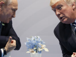 Then-U.S. President Donald Trump, right, meets with Russian President Vladimir Putin at the G20 Summit in Hamburg, Germany, Friday, July 7, 2017. (AP Photo/Evan Vucci, File)