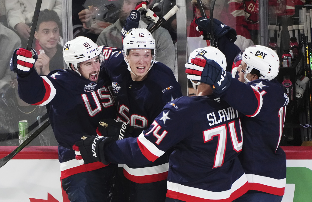 United States' Dylan Larkin (left) celebrates his goal against Canada with Matt Boldy, left to right, Jaccob Slavin and Brock Faber during second period 4 Nations Face-Off hockey action in Montreal on Saturday, Feb. 15, 2025. (Christinne Muschi/The Canadian Press via AP)