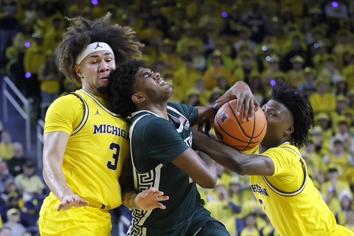 Richardson nets 21 points as No. 14 Michigan State defeats No. 12 Michigan 75-62, claiming top spot in the Big Ten.