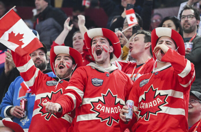 Canada fans cheer their team as they take to the ice ahead of their 4 Nations Face-Off hockey game against the United States in Montreal, Saturday, Feb. 15, 2025, in Montreal. (Christinne Muschi/The Canadian Press via AP)