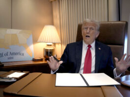 President Donald Trump speaks to reporters aboard Air Force One as he prepares to sign a proclamation declaring Feb. 9 Gulf of America Day as he travels from West Palm Beach, Fla. to New Orleans, Sunday, Feb. 9, 2025. (AP Photo/Ben Curtis)