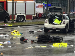 Emergency services attend the scene of an accident after a driver hit a group of people in Munich, Germany, Thursday Feb. 13, 2025. (Christoph Trost/dpa via AP)