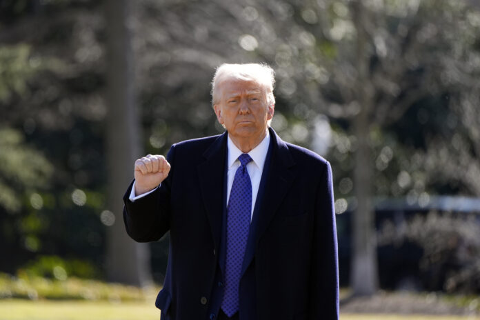 President Donald Trump walks to board Marine One as he departs from the South Lawn of the White House, Friday, Feb. 14, 2025, in Washington. (AP Photo/Alex Brandon)