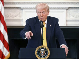 President Donald Trump speaks at the Governors Working Session in the State Dining Room of the White House in Washington, Friday, Feb. 21, 2025. (Pool via AP)