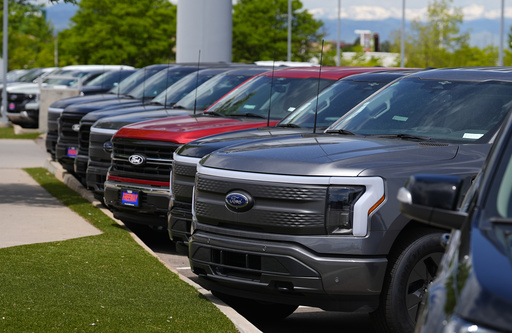 Ford stock drops as company predicts lower growth and additional losses for its electric vehicle division.