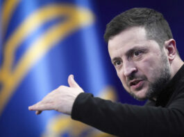 Ukrainian President Volodymyr Zelenskyy answers media questions during his press conference, in Kyiv, Ukraine, Sunday, Feb. 23, 2025. (AP Photo/Evgeniy Maloletka)