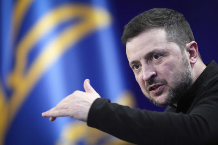 Ukrainian President Volodymyr Zelenskyy answers media questions during his press conference, in Kyiv, Ukraine, Sunday, Feb. 23, 2025. (AP Photo/Evgeniy Maloletka)