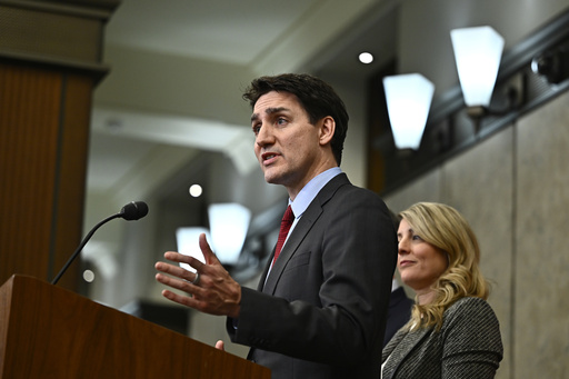 Canada's Prime Minister Justin Trudeau addresses media following the imposition of a raft of tariffs by U.S. President Donald Trump against Canada, Mexico and China, in Ottawa, Saturday, Feb. 1, 2025. (Justin Tang/The Canadian Press via AP)