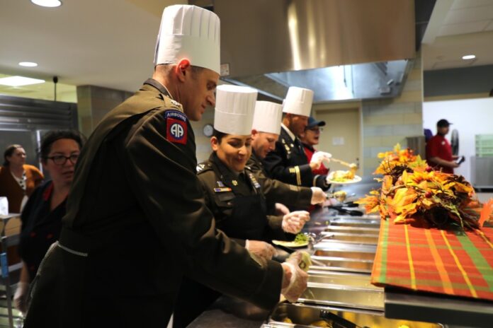 Soldiers and civilians gathered for the 2024 Thanksgiving meal on November 6 at Dining Facility 1362, Fort McCoy, Wisconsin. The feast featured traditional Thanksgiving staples served by 