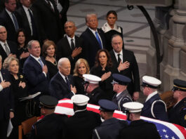 WASHINGTON, DC - JANUARY 9: Former President Bill Clinton, former Secretary of State Hillary Clinton, former President George W. Bush, former First Lady Laura Bush, former President Barack Obama, President-elect Donald Trump and his wife Melania Trump, President Joe Biden, First Lady Jill Biden, Vice President Kamala Harris and Second Gentleman Doug Emhoff watch as the casket of former President Jimmy Carter is carried away during state funeral services at the National Cathedral at the National Cathedral on January 9, 2025 in Washington, D.C. (Photo by Demetrius Freeman/The Washington Post via Getty Images)