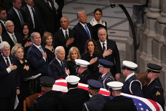 WASHINGTON, DC - JANUARY 9: Former President Bill Clinton, former Secretary of State Hillary Clinton, former President George W. Bush, former First Lady Laura Bush, former President Barack Obama, President-elect Donald Trump and his wife Melania Trump, President Joe Biden, First Lady Jill Biden, Vice President Kamala Harris and Second Gentleman Doug Emhoff watch as the casket of former President Jimmy Carter is carried away during state funeral services at the National Cathedral at the National Cathedral on January 9, 2025 in Washington, D.C. (Photo by Demetrius Freeman/The Washington Post via Getty Images)