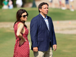 JUNO BEACH, FLORIDA - MAY 08: Florida governor Ron DeSantis and wife Casey DeSantis look on during Day One of The Walker Cup at Seminole Golf Club on May 08, 2021 in Juno Beach, Florida. (Photo by Sam Greenwood/R&A/R&A via Getty Images)