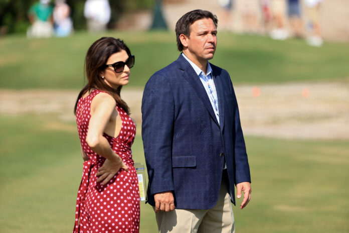 JUNO BEACH, FLORIDA - MAY 08: Florida governor Ron DeSantis and wife Casey DeSantis look on during Day One of The Walker Cup at Seminole Golf Club on May 08, 2021 in Juno Beach, Florida. (Photo by Sam Greenwood/R&A/R&A via Getty Images)