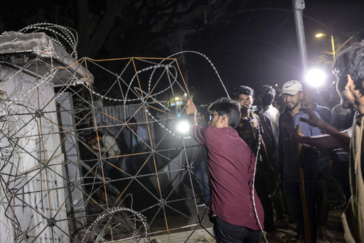 Bangladesh protesters invade and dismantle property associated with exiled ex-PM Hasina.