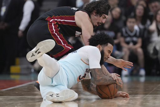 Adebayo sinks 19-foot jumper as time expires to finish with 30 points in Heat’s 105-103 victory against Spurs.