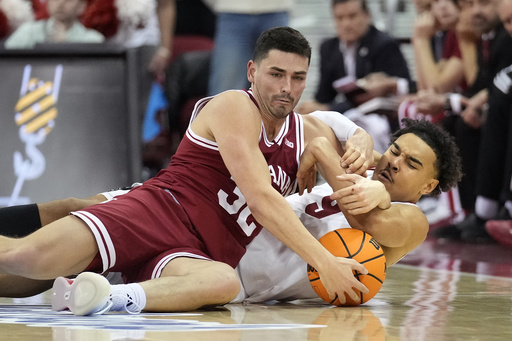 No. 21 Wisconsin easily defeats Indiana 76-64, marking their 21st consecutive victory over the Hoosiers in Madison.