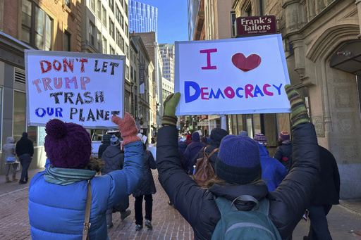 Thousands rally in Boston to advocate for democracy and oppose Trump and Musk’s policies.