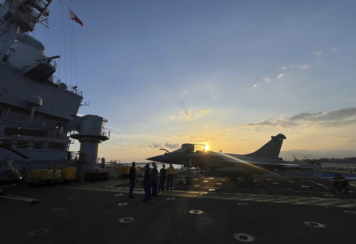 French naval carrier conducts military exercises with Filipino forces in contested waters and arrives in the Philippines.